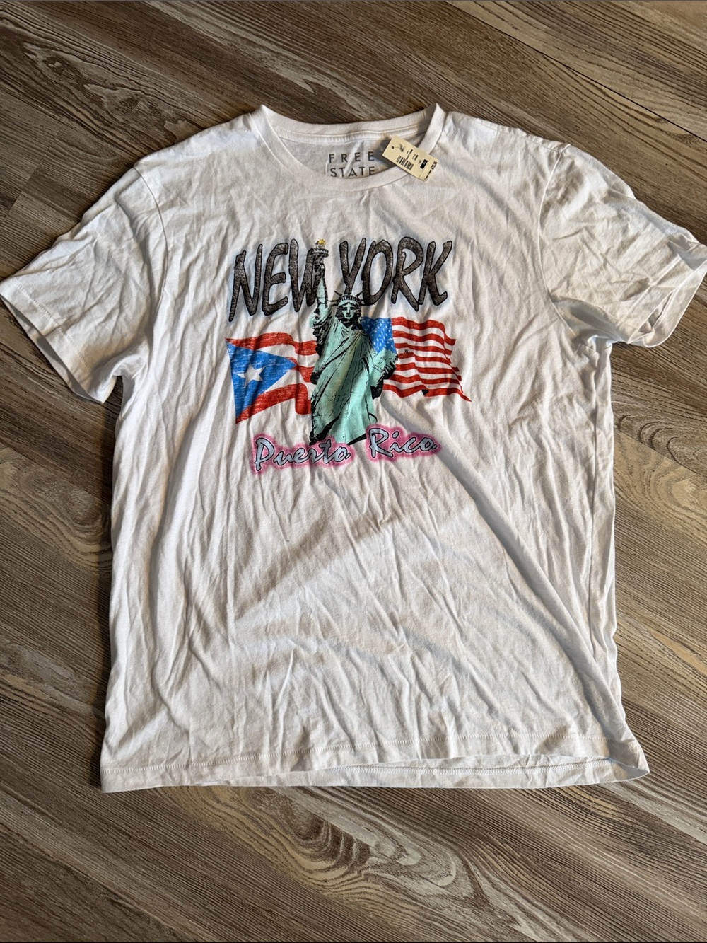 Free State White Graphic Tee with Statue of Liberty and Flags